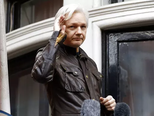 WikiLeaks founder Julian Assange greets supporters from a balcony of the Ecuadorian embassy in London, May 19, 2017. Britain’s top court on Monday March 14, 2022, refused WikiLeaks founder Julian Assange permission to appeal against a decision to extradite him to the U.S. to face spying charges. (AP Photo/Frank Augstein, File)