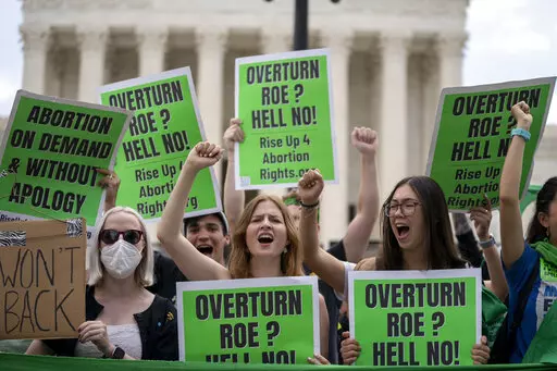 Abortion-rights protesters regroup and protest following Supreme Court's decision to overturn Roe v. Wade in Washington, Friday, June 24, 2022.  Voters in a handful of states will weigh in on abortion in this year’s election in the aftermath of the Supreme Court’s ruling that overturned Roe v. Wade and left abortion rights to the states.  (AP Photo/Gemunu Amarasinghe)