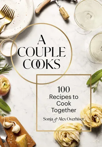 This cover image released by Chronicle Books shows "A Couple Cooks: 100 Recipes to Cook Together" by Sonya and Alex Overhiser. (Chronicle Books via AP)