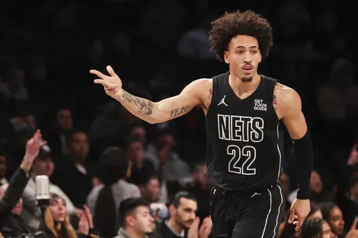 Brooklyn Nets forward Jalen Wilson (22) gestures after making a three-point basket during the first half of an NBA basketball game against the New Orleans Pelicans, Tuesday, April 8, 2025, in New York. (AP Photo/Heather Khalifa)