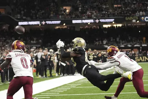 New Orleans Saints tight end Juwan Johnson (83) missed a two point conversion in the second half of an NFL football game against the Washington Commanders in New Orleans, Sunday, Dec. 15, 2024. (AP Photo/Gerald Herbert)