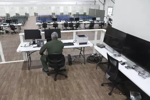 In this photo provided by the U.S. Customs and Border Protection is an interior view of the soft-sided migrant processing facility in Laredo, Texas, on Sept. 23, 2021. As the Biden administration prepared to launch speedy asylum screenings at the border in April, authorities pledged a key difference from a Trump-era version of the policy: Migrants would be guaranteed access to legal representation. Nearly three months and thousands of screenings later, the promise of attorney access appears unfu