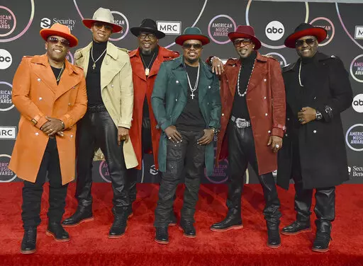 Michael Bivins, from left, Ronnie Devoe, Bobby Brown, Ricky Bell, Ralph Tresvant and Johnny Gill of New Edition appear in the press room at the American Music Awards in Los Angeles on Nov. 21, 2021. The group will perform on ABC's “New Year’s Rockin’ Eve.” (Photo by Jordan Strauss/Invision/AP, File)