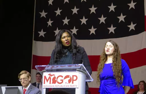 Kristina Karamo speaks to Michigan Republican Party delegates Saturday, Feb. 18, 2023, in Lansing, Mich. Karamo, who was overwhelmingly defeated in her bid to become Michigan’s secretary of state, was chosen Saturday to lead the state's Republican Party for the next two years. (AP Photo/Joey Cappelletti)