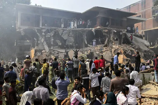 People stand around the vandalized residence of Sheikh Mujibur Rahman, Bangladesh's former leader and the father of the country's ousted Prime Minister Sheikh Hasina, in Dhaka, Bangladesh, Thursday, Feb. 6, 2025. (AP Photo/Mahmud Hossain Opu)