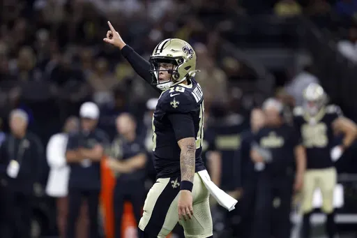New Orleans Saints quarterback Spencer Rattler (18) reacts to a play during an NFL preseason football game against the Tennessee Titans, Aug. 25, 2024, in New Orleans. (AP Photo/Tyler Kaufman, File)