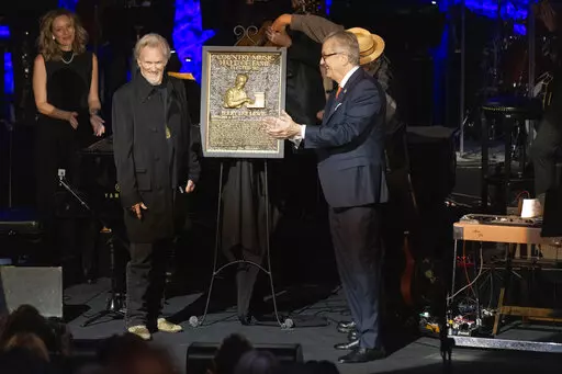 Kris Kristofferson, left, stands with the plaque of honoree Jerry Lee Lewis during the Country Music Hall of Fame Medallion Ceremony on Sunday, Oct. 16, 2022, at the Country Music Hall of Fame in Nashville, Tenn. (Photo by Wade Payne/Invision/AP)