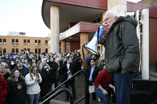 Sen. Bernie Sanders, I-Vt., right, speaks to an overflow crowd outside Lincoln High School as he talks about "Fighting Oligarchy: Where We Go From Here", Saturday, March 8, 2025, in Warren, Mich. (AP Photo/Jose Juarez)
