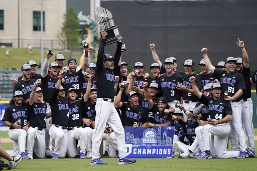 Duke coach Chris Pollard holds the trophy after a win overt North Carolina State in an NCAA college baseball game during the Atlantic Coast Conference championship game on Sunday, May 30, 2021, in Charlotte, N.C. Duke moved into the top 10 of the national rankings Monday, March 11, 2024, after winning two of three on the road against Wake Forest, which had opened the season No. 1 in the major polls. (AP Photo/Chris Carlson, File)