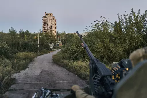 A Ukrainian soldier sits in his position in Avdiivka, Donetsk region, Ukraine, on Aug. 18, 2023. Ukrainian troops are under intense pressure from a determined Russian effort to storm the strategically important eastern Ukraine city of Avdiivka, officials say. Kyiv’s army is struggling with ammunition shortages as the Kremlin’s forces pursue a battlefield triumph around the two-year anniversary of Moscow’s full-scale invasion and ahead of a March presidential election in Russia. (AP Photo/L