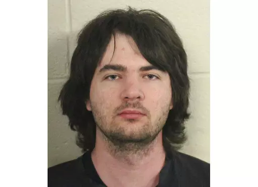 This photo provided by Floyd County, Ga., Police shows Robert Keith Tincher III.  Police say Tincher killed his grandmother by stuffing her in a freezer while she was still alive. Floyd County Police discovered the body of Doris Cumming, 82, late Thursday, April 14, 2022,  in the Armuchee home she shared with her grandson, 29-year-old Robert Keith Tincher III.(Floyd County, GA., Police via AP)