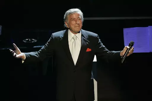 Tony Bennett reacts after performing the song "I left My Heart in San Francisco" during his 80th birthday celebration at the Kodak Theater in Los Angeles, on Nov. 9, 2006. Bennett, the eminent and timeless stylist whose devotion to classic American songs and knack for creating new standards, graced a decadeslong career that brought him admirers from Frank Sinatra to Lady Gaga, died Friday, July 21, 2023. He was 96. (AP Photo/Kevork Djansezian, File)