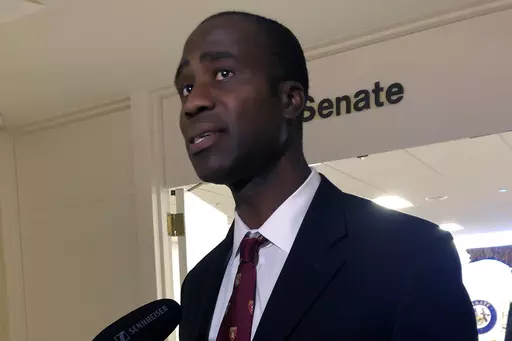 Dr. Joseph Ladapo speaks with reporters after the Florida Senate confirmed his appointment as the state's surgeon general on Feb. 23, 2022, in Tallahassee, Fla. An analysis that was the basis of a highly criticized recommendation from Florida’s surgeon general cautioning young men against getting the COVID-19 vaccine omitted information that showed catching the virus could increase the risk of a cardiac-related death much more than getting the shot. That's according to drafts of the analysis o
