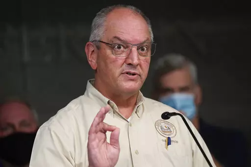 Louisiana Gov. John Bel Edwards speaks during news conference, Sept. 1, 2021, in Gretna, La.  With the state heading into the peak of Carnival season,  Edwards extended Louisiana's COVID-19 health emergency declaration Wednesday, Feb. 16, 2022, but did not re-institute long expired mask mandates or gathering restrictions.  (AP Photo/David J. Phillip)