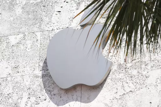 The Apple logo is displayed over their store, Sept. 19, 2023, in Miami Beach, Fla. On Wednesday, Jan. 17, 2024, a federal appeals court decided to revive a U.S. sales ban on Apple's premium watches while it referees a patent dispute revolving around a sensor, raising the specter that the company will pull the devices from stores for the second time in less than a month. (AP Photo/Marta Lavandier, File)