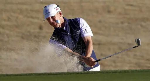 David Toms hits out of a bunker on the 18th hole during the second round of PGA Tour Champions' Cologuard Classic golf tournament in Tucson, Ariz., Saturday, March 4, 2023. (Kelly Presnell/Arizona Daily Star via AP)