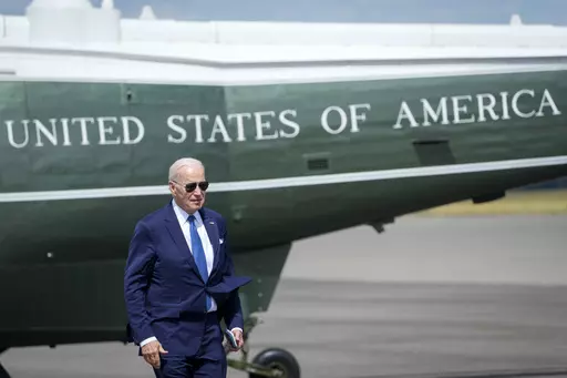US President Joe Biden walks backdropped by Marine One upon arriving at Stansted airport, in London, Monday, July 10, 2023. (AP Photo/Susan Walsh)