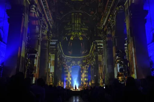 Video projections are seen Thursday Oct.31, 2024 at the Saint-Sulpice church in Paris. (AP Photo/Marine Lesprit)
