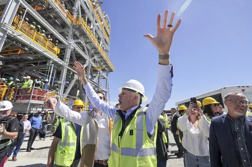 U.S. Secretary of Energy Chris Wright greets workers at Venture Global's Plaquemines LNG export facility Thursday, March 6, 2025, in Plaquemines, La. (Brett Duke/The Advocate via AP)