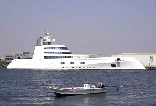 The 118-meter (387-foot) Motor Yacht A belonging to  Russian oligarch Andrey Melnichenko is anchored in the port of Ras al-Khaimah, United Arab Emirates, Tuesday, May 31, 2022. In the dusty, northern-most sheikhdom of the United Arab Emirates, Motor Yacht A, one of the world's largest yachts, sits in the quiet port — so far avoiding the fate of other luxury vessels linked to sanctioned Russian oligarchs. (AP Photo/Kamran Jebreili)