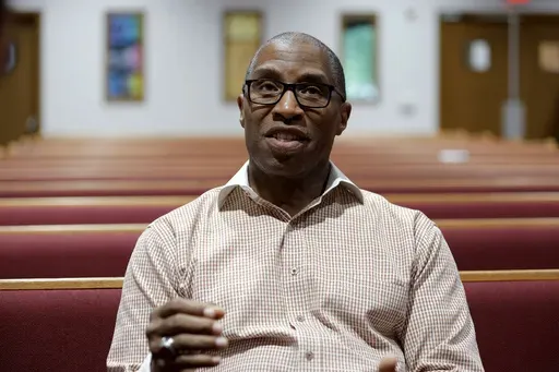 Dr. Craig Tatum, pastor for New Life Baptist Church Ministries, talks about voting in the November presidential election, Tuesday, July 9, 2024, in Saginaw, Mich. President Joe Biden says the pressure on him to end his reelection campaign is coming from Democratic Party “elites." But a sampling of voters and Democratic activists in several key swing states paints a far more complicated picture in the aftermath of Biden’s disastrous debate performance. Tatum says many people he speaks with fo
