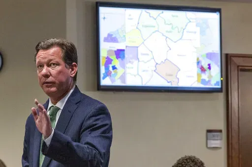 Phil Strach, an attorney for Republican legislators, questions state Rep. Destin Hall, a top Republican redistricting official, during a partisan gerrymandering trial on Jan. 5, 2022, at Campbell University School of Law in Raleigh, N.C.  North Carolina’s Republican legislative leaders have asked the U.S. Supreme Court to curtail state courts’ powers to intervene in the drawing of congressional districts, Friday, March 18 2022,  as part of an ongoing battle over electoral maps. (Travis Long/