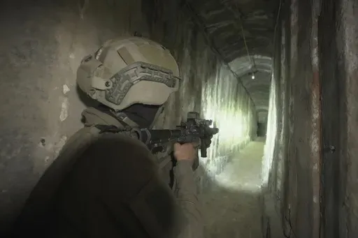 Israeli soldiers show the media an underground tunnel found underneath Shifa Hospital in Gaza City, Wednesday, Nov. 22, 2023. Israel says that Hamas militants sought cover on the grounds of the hospital and used the tunnel for military purposes. (AP Photo/Victor R. Caivano)