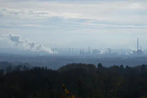 Smoke rises form chimneys of a steel plant in Ostrava, Czech Republic, Friday, Nov. 11, 2022. High energy prices linked to Russia's war in Ukraine have paved the way for coal’s comeback, endangering climate goals and threatening health from increased pollution. (AP Photo/Petr David Josek)