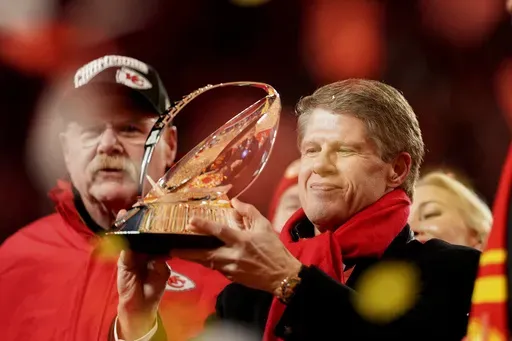 Kansas City Chiefs owner Clark Hunt holds the Lamar Hunt Trophy after the Chiefs defeated the Buffalo Bills in the AFC Championship NFL football game, Sunday, Jan. 26, 2025, in Kansas City, Mo. (AP Photo/Charlie Riedel)