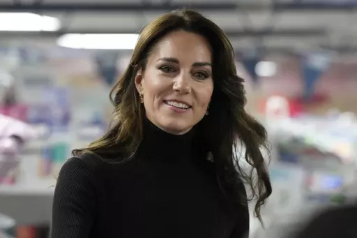 Britain's Kate, Princess of Wales smiles during her visit to Sebby's Corner in north London, Friday, Nov. 24, 2023. Princess Kate apologized Monday, March 11, 2024 for “confusion” caused by her editing of a family photo released by the palace — an image of the British royal and her children that was intended to calm concern and speculation about the princess's health, but had the opposite effect. (AP Photo/Frank Augstein, Pool, File )