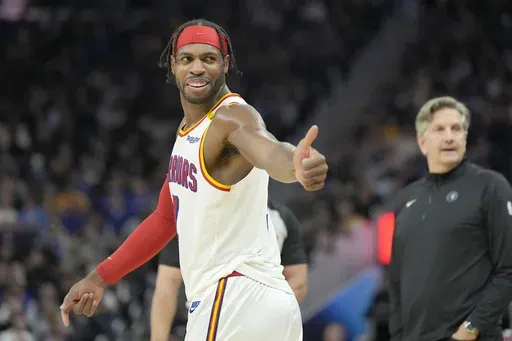 Golden State Warriors guard Buddy Hield, left, gestures to the Minnesota Timberwolves' bench during the second half of an NBA basketball game in San Francisco, Dec. 8, 2024. (AP Photo/Tony Avelar, File)