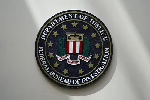 An FBI seal is seen on a wall on Aug. 10, 2022, in Omaha, Neb. (AP Photo/Charlie Neibergall, File)