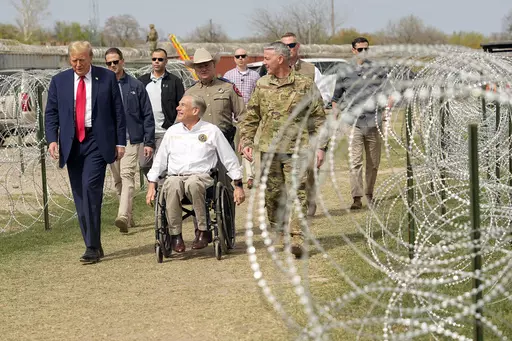 Republican presidential candidate former President Donald Trump talks with Texas Gov. Greg Abbott during a visit to the U.S.-Mexico border, Feb. 29, 2024, in Eagle Pass, Texas. As Trump campaigns on the promises of mass deportations and pardons for those convicted in the Jan. 6 Capitol attack, his ideas are being met with little pushback by a new era of Republicans in Congress. It's a shift from the first time around when Trump encountered early skepticism and, once in a while, the uproar of con