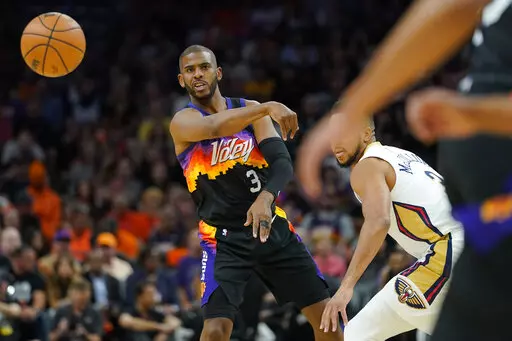 Phoenix Suns guard Chris Paul (3) passes against the New Orleans Pelicans during the first half of Game 5 of an NBA basketball first-round playoff series, Tuesday, April 26, 2022, in Phoenix. (AP Photo/Matt York)