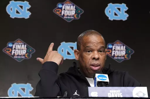 North Carolina coach Hubert Davis answers a question during a news conference at the men's Final Four NCAA college basketball tournament Thursday, March 31, 2022, in New Orleans. North Carolina will play Duke Saturday. (AP Photo/David J. Phillip)