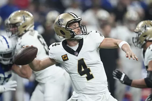 New Orleans Saints quarterback Derek Carr (4) throws against the Indianapolis Colts during the first half of an NFL football game Sunday, Oct. 29, 2023 in Indianapolis. (AP Photo/Darron Cummings)