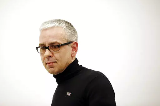 Russian businessman Dmitry Kovtun arrives for a news conference at Interfax headquarters in Moscow, Russia, Wednesday, April 8, 2015. Russian agent Kovtun, who was accused by the U.K. authorities in the poisoning death of former spy Alexander Litvinenko in London in 2006, died Saturday, June 4, 2022, at age 57. (AP Photo/Pavel Golovkin, File)