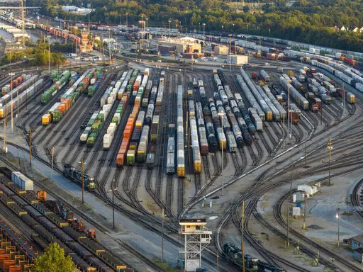 Freight train cars sit in a Norfolk Southern rail yard on Sept. 14, 2022, in Atlanta. The Biden administration is saying the U.S. economy would face a severe economic shock if senators don't pass legislation this week to avert a rail worker strike. The administration is delivering that message personally to Democratic senators in a closed-door session Thursday, Dec. 1. (AP Photo/Danny Karnik, File)