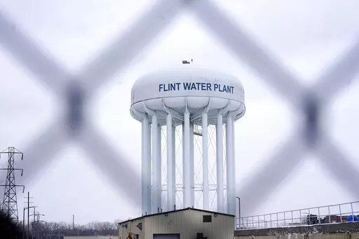 The Flint water plant tower is seen on Jan. 6, 2022, in Flint, Mich.  A Michigan judge dismissed charges Tuesday, Oct. 4, 2022,  against seven people in the Flint water scandal, including two former state health officials blamed for deaths from Legionnaires' disease. Judge Elizabeth Kelly took action three months after the Michigan Supreme Court said a one-judge grand jury had no authority to issue indictments. (AP Photo/Carlos Osorio, File)