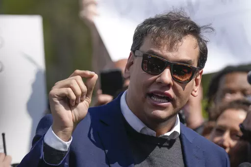 U.S. Rep. George Santos speaks to reporters as he leaves the federal courthouse in Central Islip, N.Y., Wednesday, May 10, 2023. A 13-count federal indictment unsealed in New York accuses Santos of embezzling money from his campaign, falsely receiving unemployment funds and lying to Congress about his finances. (AP Photo/Seth Wenig)
