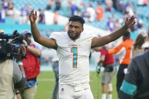Miami Dolphins quarterback Tua Tagovailoa (1) gestures at the end of an NFL football game against the New York Giants, Sunday, Dec. 5, 2021, in Miami Gardens, Fla. The Dolphins defeated the Giants 20-9. (AP Photo/Wilfredo Lee)