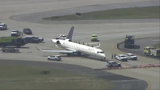 A plane sits damaged at Hartsfield-Jackson Atlanta International Airport after colliding with another plane on a taxiway, Tuesday, Sept. 10, 2024. (WSB via AP)