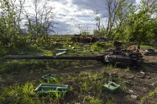 A destroyed tank near the village of Malaya Rohan, Kharkiv region, Ukraine, Monday, May 16, 2022. Twitter is stepping up its fight against misinformation with a new policy cracking down on posts that spread potentially dangerous false stories. Under the new rules, which take effect Thursday, May 19, 2022, Twitter will no longer automatically recommend posts that mischaracterize conditions during a conflict or make misleading claims about war crimes or atrocities. (AP Photo/Bernat Armangue, File)