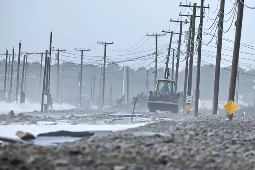 The remnants of East Beach Road are damaged after heavy overnight winds and surf battered the coastline, Wednesday, Jan. 10, 2024 in Westport, Mass. Salisbury, Mass., is scrambling after a weekend storm washed away mountains of sand trucked in for nearly $600,000 dune that was meant to protect homes, roads and other infrastructure. The community and other areas of Massachusetts also were hit by severe storms in January, including flooding, erosion, and infrastructure damage. (Peter Pereira/The S
