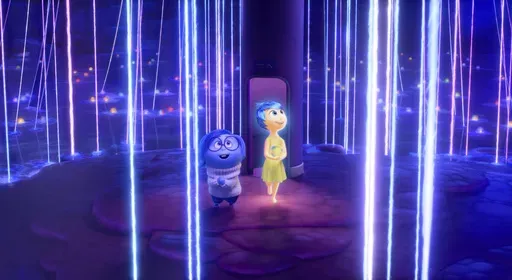 This image released by The Walt Disney Studios shows the characters Sadness, voiced by Phyllis Smith, left, and Joy voiced by Amy Poehler, in a scene from "Inside Out 2." (The Walt Disney Studios via AP)
