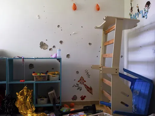 Bullet holes cover the bedroom wall of hostage Ariel Bibas, 4, in Kibbutz Nir Oz, Israel, on Friday, June 21, 2024. Ariel was kidnapped on Oct. 7, with his infant brother, Kfir, his mother, Shiri, and his father, Yarden. (AP Photo/Oded Balilty)