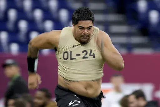 Oregon State offensive lineman Taliese Fuaga runs the 40-yard dash during the NFL football scouting combine, Sunday, March 3, 2024, in Indianapolis. Fuaga has been mentioned as a possible NFL Draft first round pick by the Cincinnati Bengals. (AP Photo/Charlie Riedel, File)