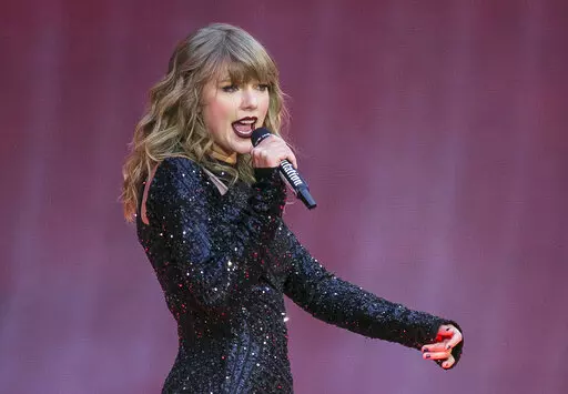Singer Taylor Swift performs on stage in a concert at Wembley Stadium on June 22, 2018, in London. On the heels of a messy ticket roll out for Swift’s first tour in years, fans are angry; they’re also energized against Ticketmaster. While researchers agree that there’s no way to tell how long the energy could last, the outrage shows a way for young people to become more politically engaged through fan culture. (Photo by Joel C Ryan/Invision/AP, File)