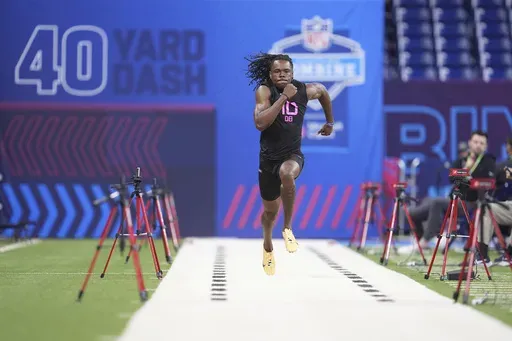 Kentucky defensive back Max Hairston runs the 40-yard dash at the NFL football scouting combine in Indianapolis, Friday, Jan. 28, 2025. (AP Photo/Michael Conroy)