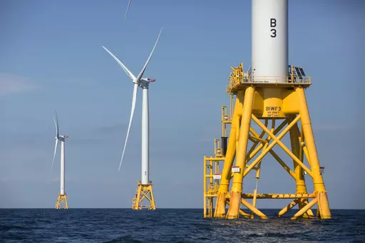 Three wind turbines stand in the water off Block Island, R.I, the nation's first offshore wind farm, Aug. 15, 2016. In a first-of-its kind auction for the Gulf of Mexico, a company bid $5.6 million Tuesday, Aug. 29, 2023 to lease federal waters off the Louisiana coast for wind energy generation. (AP Photo/Michael Dwyer, File)